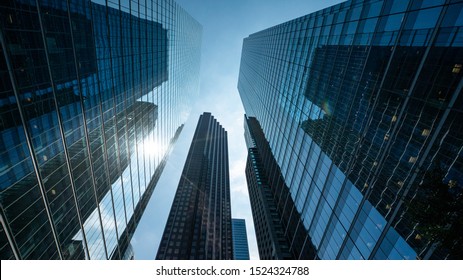 Impressive corporate builings with lens flare and blue sky