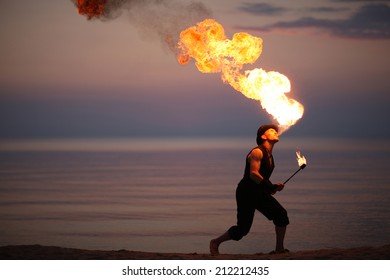 Impressive fire breath of a showman - Powered by Shutterstock