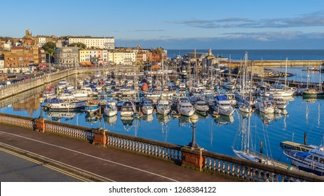 The impressive and historic Royal Harbour of Ramsgate, Kent, Uk, full of leaisure and fishing boats of all sizes and the colourful facade of the historic buildings along the marina promenade