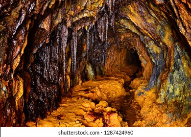 Impressive limonite stalactites in an abandoned mine contaminated with iron oxides in Pezinok, western Slovakia. 