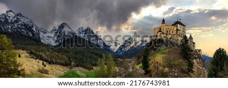 Impressive  mountain scenery with amazing medieval castle Tarasp surrounded by  Swiss Alps, Canton Grisons or Graubuendon, Switzerland