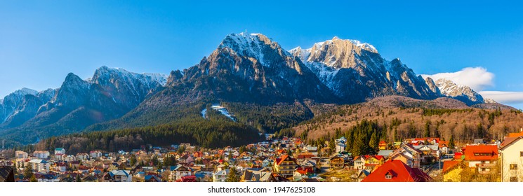 Impressive panorama view on Bucegi Mountains from Busteni City, Prahova Valley, Prahova County, Romania, in winter