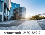 Impressive panoramic photo of skyscrapers against a bright blue sky. This urban scene showcases modern architecture including tall buildings and a sparkling city skyline. Perfect as a visual backdrop.