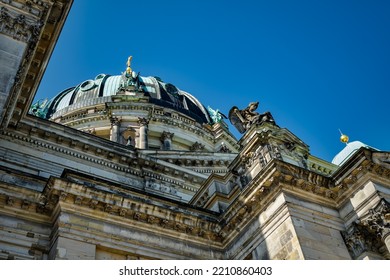 Impressive religious architecture: view from below to the staggered facade and the cupola of the Berlin Cathedral - Shutterstock ID 2210860403