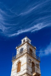 Impressive Stone-built Belfry With Beautiful Cloud Stripes Over An Intensevily Blue Sky, In The Picturesque Village Of Krokos, In Kozani Region, Macedonia, Greece, Europe.