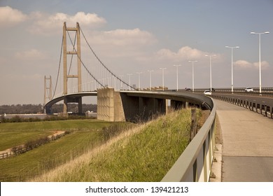 The impressive structure of the Humber bridge spans the river Trent  and links Lincolnshire and Humberside, Yorkshire.