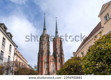 Impressive view of the Cathedral of St. John the Baptist (Breslauer Dom) with its two distinctive towers and the street view on both sides in the Polish city of Wrocław (Breslau)