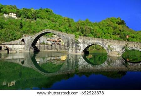 Impressive view of the medieval Devil's Bridge - Ponte della Maddalena in Tuscany, Italy