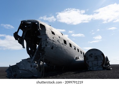 Impressive view of the Sólheimasandur Plane Wreck, the Remains of a 1973 U.S. Navy DC plane that crashed on black sand beach in Iceland