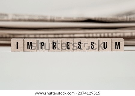 Impressum - Imprint , word concept on building blocks, text