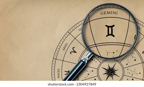 The imprint of the zodiac sign Gemini on old paper is enlarged with a lens - Powered by Shutterstock