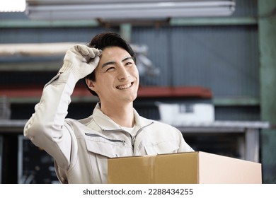 Improving the image of the transportation industry carrying cardboard boxes and the delivery industry with fresh sweat-wiping smiles - Powered by Shutterstock