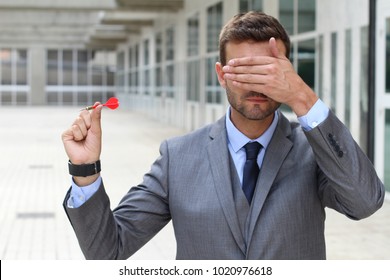 Impulsive Businessman Playing Darts With His Eyes Closed