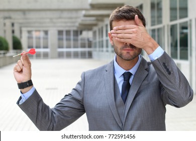 Impulsive Businessman Playing Darts In Office Space