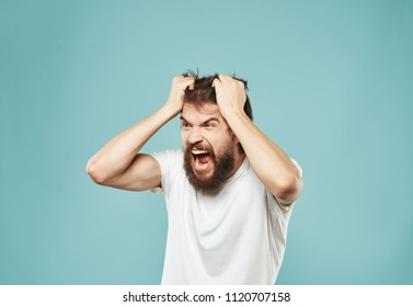 impulsive man is tearing his hair                            - Shutterstock ID 1120707158