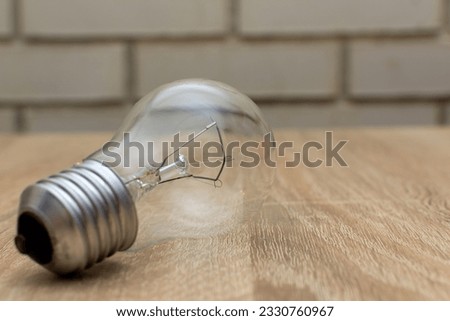 An incandescent lamp consumes much more electricity
