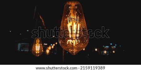 Incandescent lamps are artificial light sources that are produced by passing an electric current through a filament which then heats up and produces light.