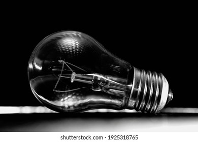 Incandescent Light Bulb On A Dark Background