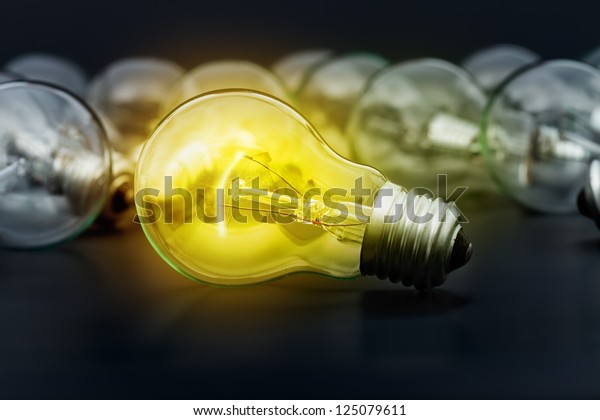 Incandescent Light Bulbs On Dark Surface Stock Photo (Edit Now) 125079611