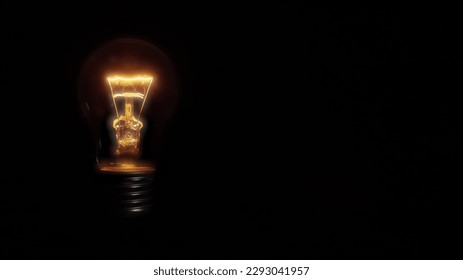 a incandescent light with voltage drop bulb on black background - Powered by Shutterstock