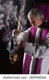 Incense In A Burner And Catholic Priest