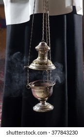 Incense Burner Held By A Catholic Priest. 