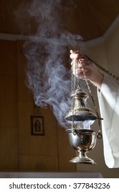 Incense Burner Held By A Catholic Priest. 