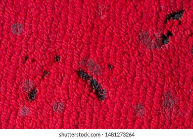 Incense And Candle Burn Marks On Red Carpet.