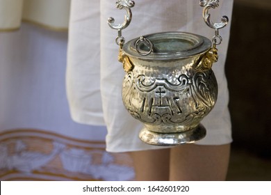 Incense Container Held By An Acolyte