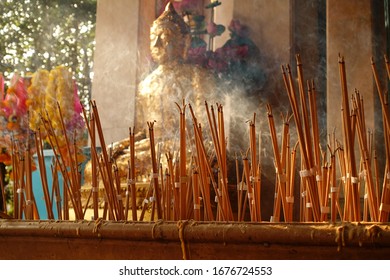 Incense in joss stick pot with Buddha statue to make a wish in the temple Thailand,Incense that was lit to worship,Make merit for Temple Thailand (Visakha Puja Day,Asalha Puja Day,Magha Puja Day) - Powered by Shutterstock