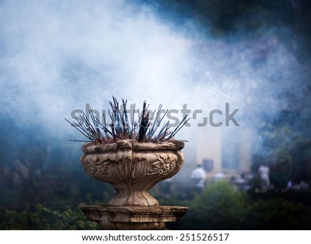 Incense sticks burning in front of Temple of the Tooth, Kandy, Sri Lanka
