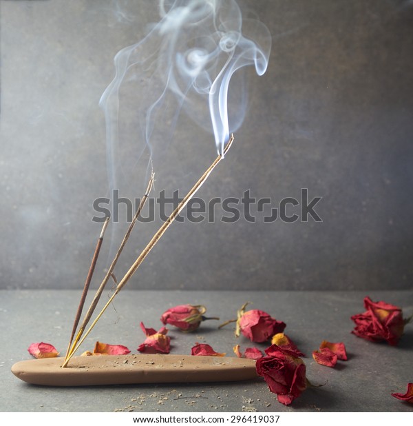incense sticks with rose\
flowers leaves