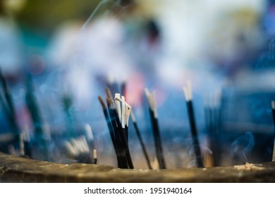 Incense sticks and the scented smoke close up in Jaya Sri Maha Bodhi Anuradhapura, pleasant scents is one of the sensory offerings Buddhist pilgrims offer before worship temple. - Powered by Shutterstock