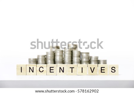 INCENTIVES text made with wood blocks.Business Concept 