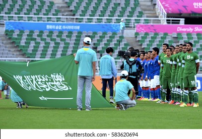 INCHEON September 17, 2014 -  Malaysian Football Team, (Blue Jersey), In Action Against The Football Team Of Saudi Arabia At Asian Games In Incheon, Korea.