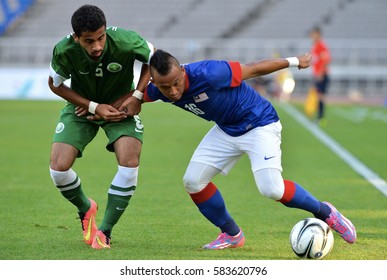 INCHEON September 17, 2014 -  Malaysian Football Team, (Blue Jersey), In Action Against The Football Team Of Saudi Arabia At Asian Games In Incheon, Korea.