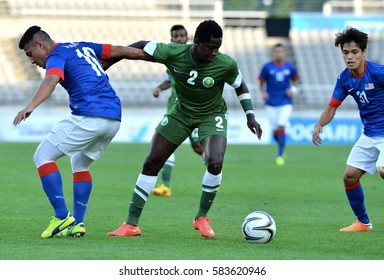 INCHEON September 17, 2014 -  Malaysian Football Team, (Blue Jersey), In Action Against The Football Team Of Saudi Arabia At Asian Games In Incheon, Korea.