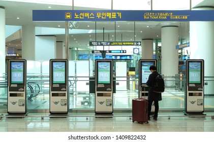 Incheon, South Korea - April 11, 2019: Young Man Buying A Ticket From Automated Self Service Machine At Incheon Airport, South Korea. Modern Technology Concept.
