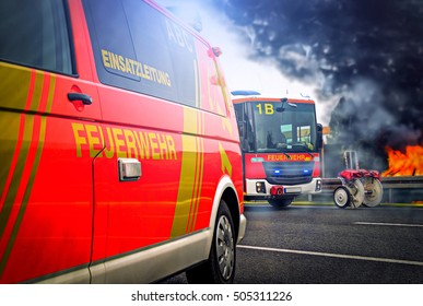 Incident Command Vehicle ( Einsatzleitung) From German (Feuerwehr) Fire Brigade Stands On A Street Near A Fire