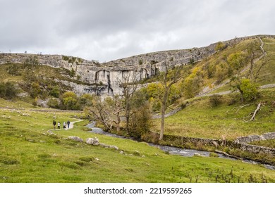 Incidental People Seen Walking Along A Pathway To Malham Cove In The Yorkshire Dales Seen In October 2022.