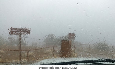 Inclement Weather Of Fog And Rain Viewed Through A Vehicle Windshield.