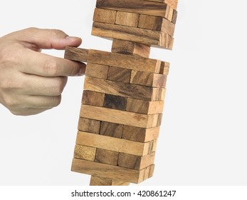 Inclined Wooden Block Tower Jenga Game With Hand, Risk Concept