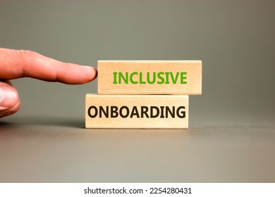 Inclusive onboarding symbol. Wooden blocks with words Inclusive onboarding on beautiful grey background. Businessman hand. Business, HR and inclusive onboarding concept. Copy space. - Shutterstock ID 2254280431