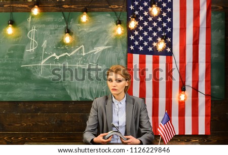 Income planning of budget increase policy. American education reform at school in july 4th. Woman with dollar money for bribe. Independence day of usa. Economy and finance. Patriotism and freedom.