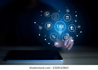 income tax concept. Businessman pointing to tax icon. income tax system icon around. pay online income tax. futuristic virtual screen interface technology. - Shutterstock ID 2328163865