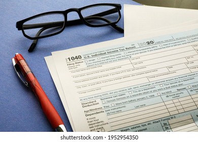 Income Tax Form 1040 Document On Blue Background