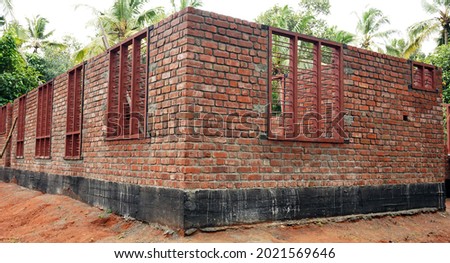Incomplete structure of a new house being built in Kerala.                               