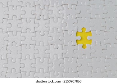 Incomplete White Jigsaw Puzzle Pieces. Flat Lay View.