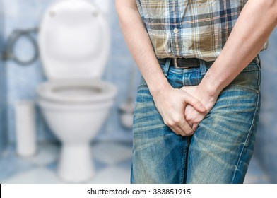 Incontinence Concept. Man Wants To Pee And Is Holding His Bladder.