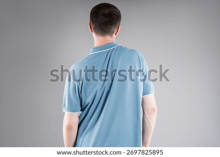 Incorrect posture, man with severe spinal curvature on gray studio background, healthcare and medicine concept